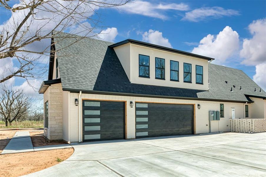 Front exterior of a new home in , Granbury, TX, highlighting curb appeal (Image 22). Front exterior of a new home in , Granbury, TX, highlighting curb appeal (Image 22).