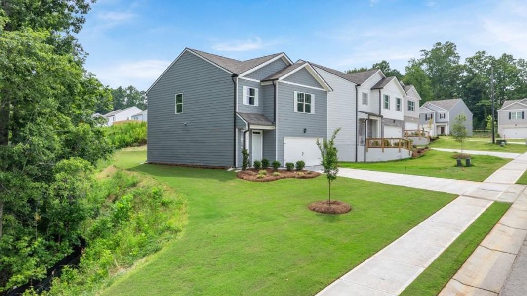 Front exterior of a new home in Oakleigh Glen, Dallas, GA, highlighting curb appeal (Image 1). Front exterior of a new home in Oakleigh Glen, Dallas, GA, highlighting curb appeal (Image 1).