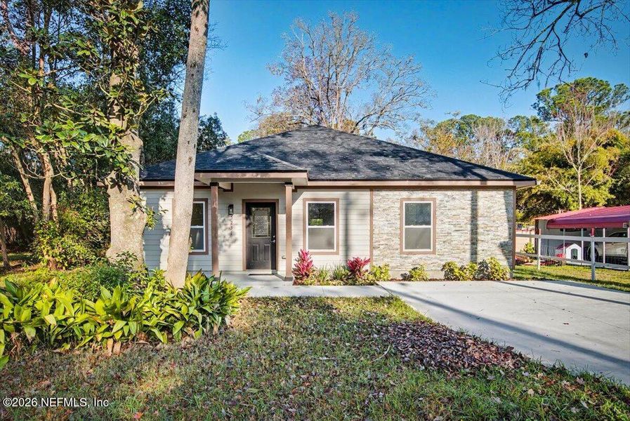 Front exterior of a new home in , Jacksonville, FL, highlighting curb appeal (Image 26).
