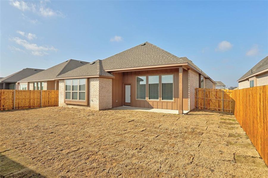 Back of property with a patio