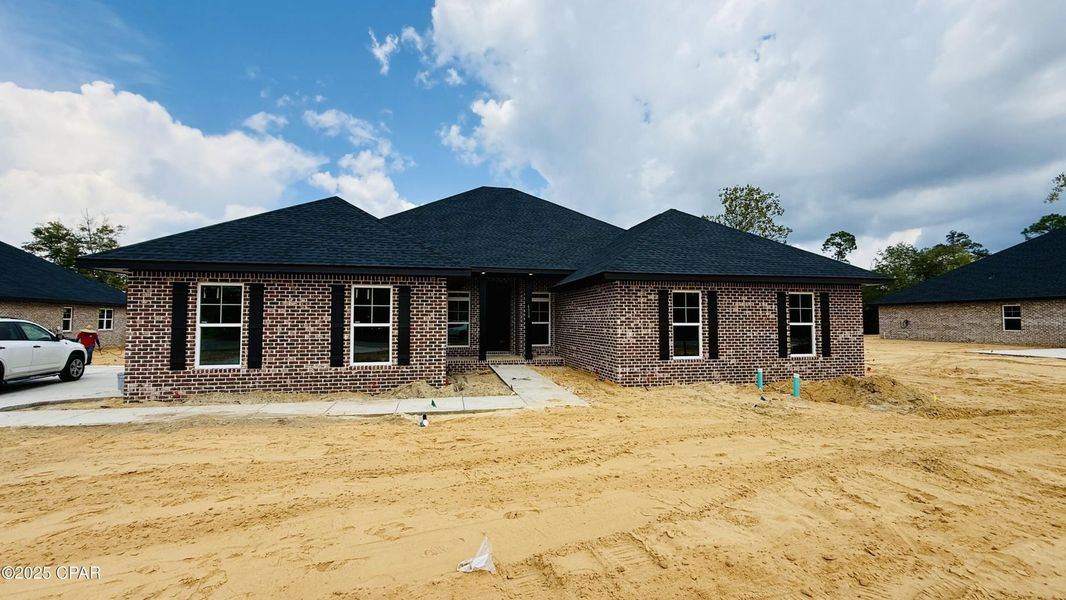 Front exterior of a new home in Cedar Creek at Deerpoint Lake, Panama City, FL, highlighting curb appeal (Image 1). Front exterior of a new home in Cedar Creek at Deerpoint Lake, Panama City, FL, highlighting curb appeal (Image 1).