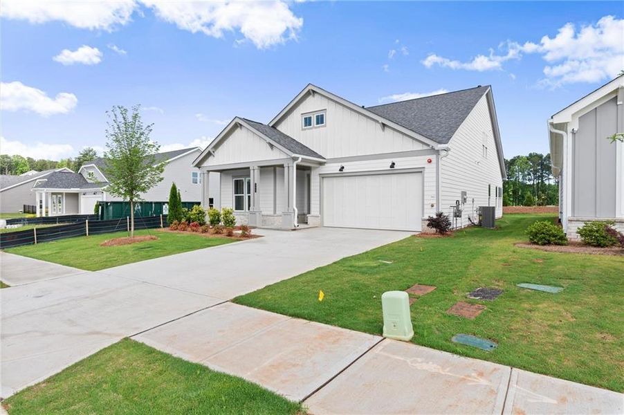 Front exterior of a new home in , Kennesaw, GA, highlighting curb appeal (Image 28).
