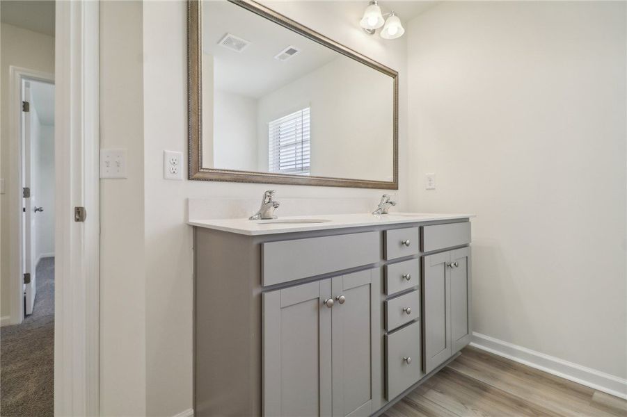 Modern bathroom featuring dual sinks and stylish c Modern bathroom featuring dual sinks and stylish c