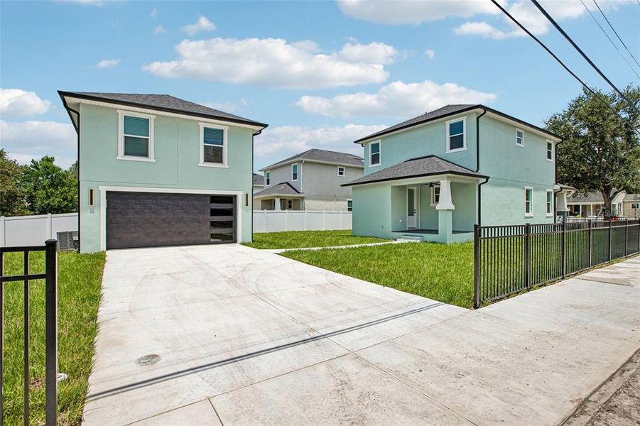 Front exterior of a new home in , Tampa, FL, highlighting curb appeal (Image 23).