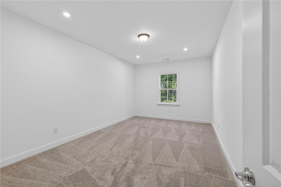 Spacious, unfurnished interior of a new home in Riversprings, Dacula (Image 37).