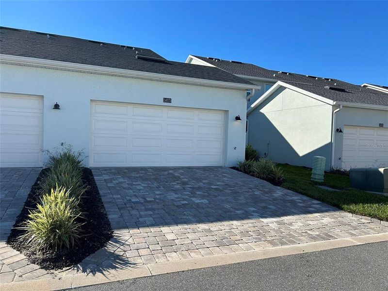 Front exterior of a new home in , Winter Garden, FL, highlighting curb appeal (Image 26).