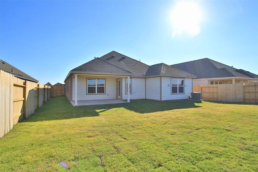 Exterior details and patio area of a home in Oakwood Estates, Waller (Image 2). Exterior details and patio area of a home in Oakwood Estates, Waller (Image 2).