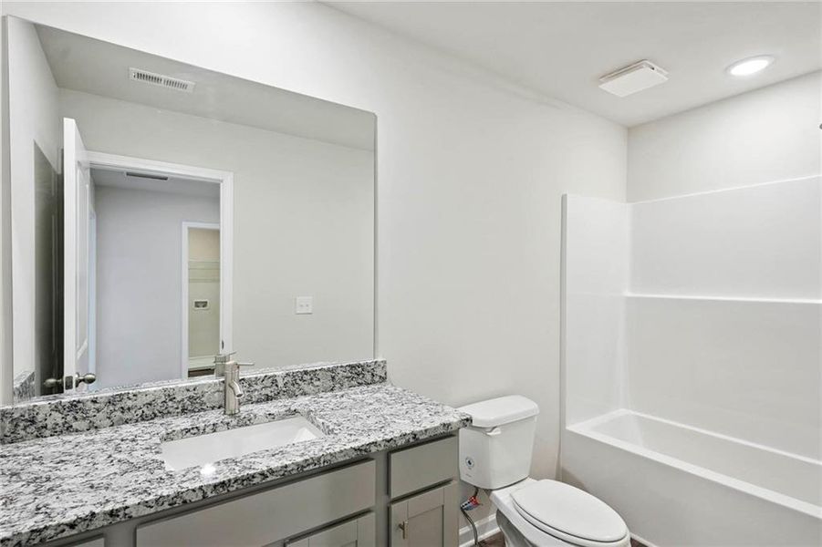 Furnished interior view inside a new home in The Enclave Townhomes, Hampton (Image 6).