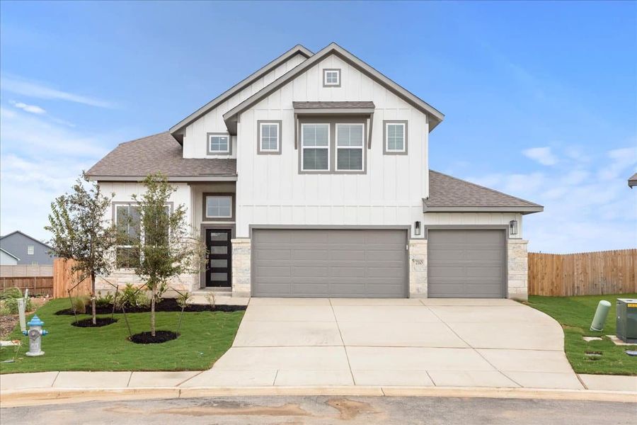 Front exterior of a new home in Village at Three Oaks, Seguin, TX, highlighting curb appeal (Image 17). Front exterior of a new home in Village at Three Oaks, Seguin, TX, highlighting curb appeal (Image 17).