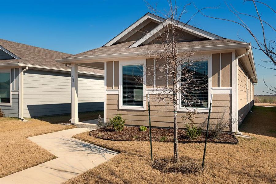 Bungalow-style home featuring a front lawn