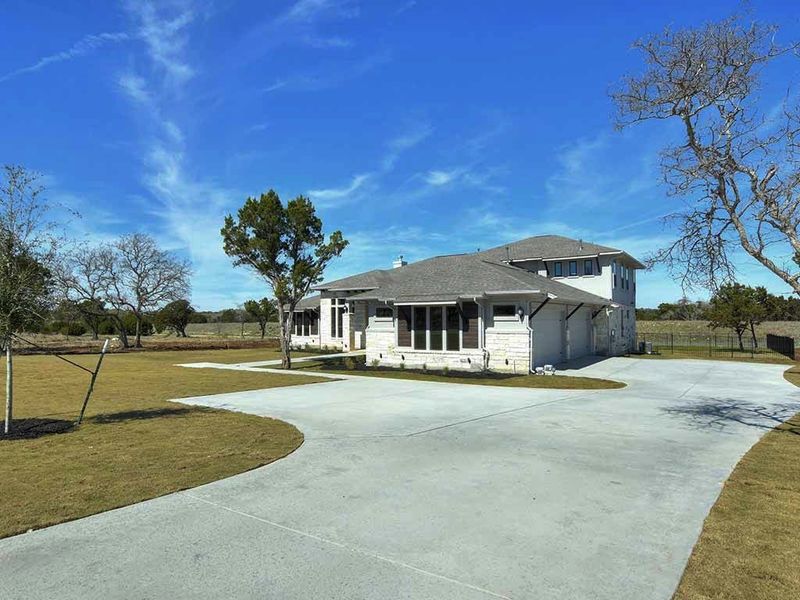 Representative exterior photo of a completed home built from the Santa Barbara II by Giddens Homes in Scofield Farms Estates, Georgetown, TX (Image 27).