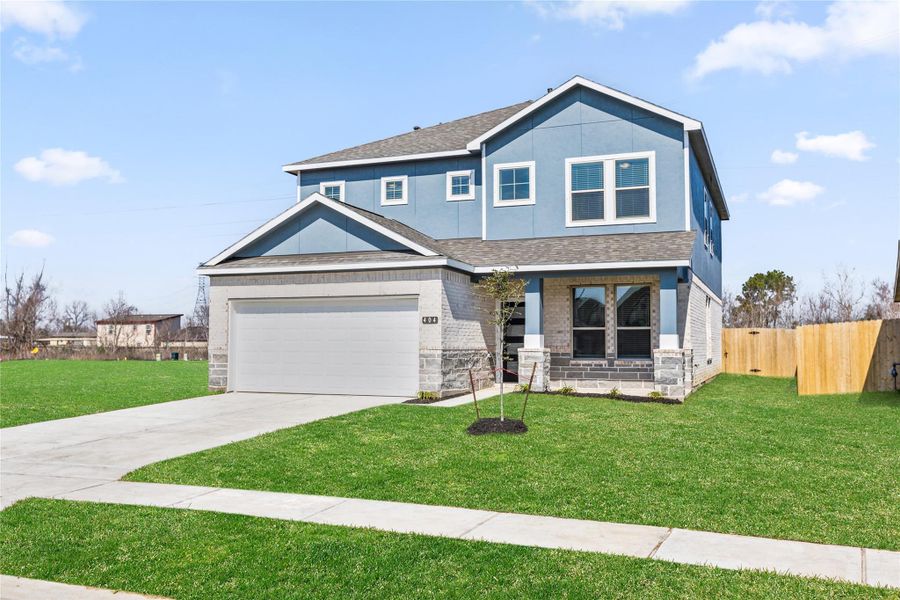 Front exterior of a new home in Kendall Lakes, Alvin, TX, highlighting curb appeal (Image 1).