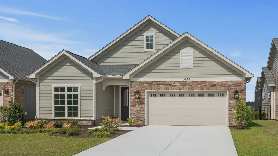 Front exterior of a new home in Courtyards by Carrell, Ocean Isle Beach, NC, highlighting curb appeal (Image 2). Front exterior of a new home in Courtyards by Carrell, Ocean Isle Beach, NC, highlighting curb appeal (Image 2).