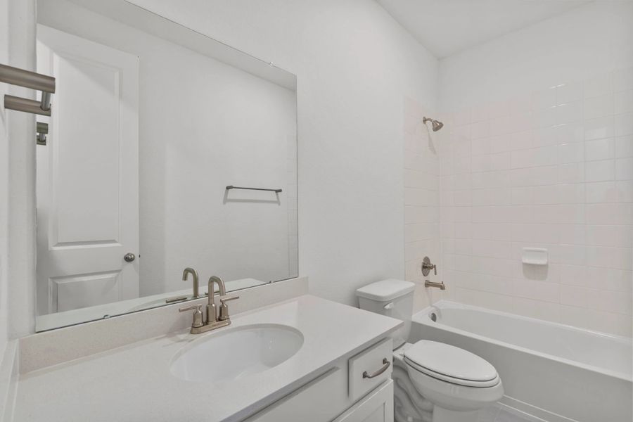 Secondary bathroom.  Sample product photo. Actual exterior and interior selections may vary by homesite. Photo may be virtually staged.