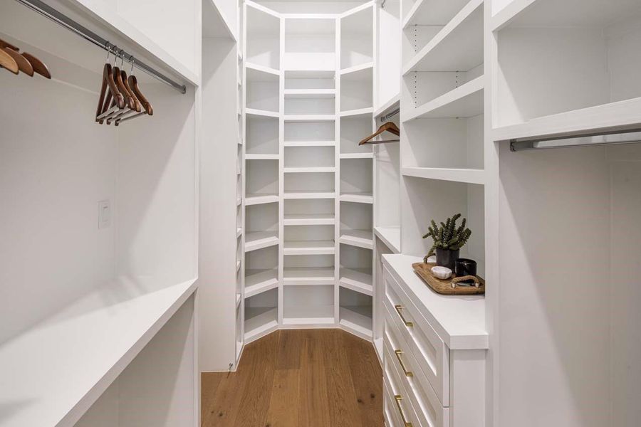 Custom primary closet to organize all your clothes and shoes.