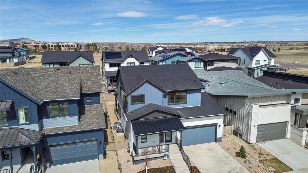 Front exterior of a new home in West Grange, Longmont, CO, highlighting curb appeal (Image 21).