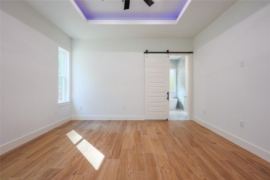 Oversized master bedroom with exclusive ceiling design and lighting along with an upgraded fan with gold accents. Oversized master bedroom with exclusive ceiling design and lighting along with an upgraded fan with gold accents.