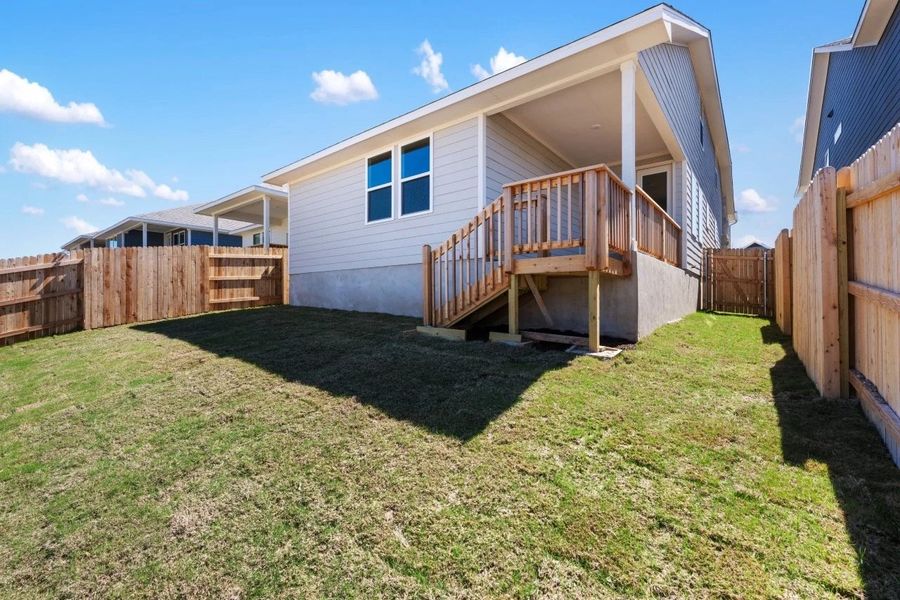 Exterior details and patio area of a home in Cannon Ranch, Dripping Springs (Image 6).