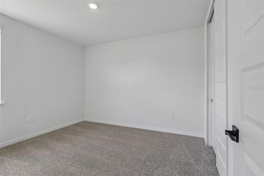 Spacious, unfurnished interior of a new home in The Grove at Stuart Crossing - Signature Series, Bartow (Image 26).