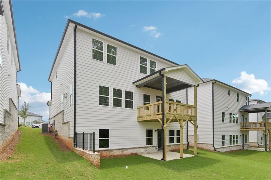 Exterior details and patio area of a home in Martin Springs - Estate Series, Lawrenceville (Image 26).