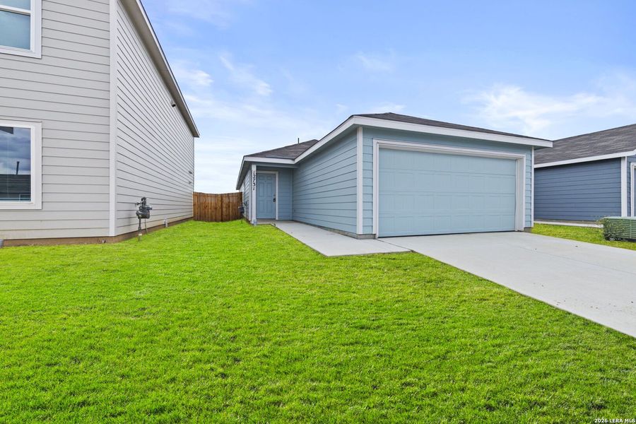 Exterior details and patio area of a home in Spring Grove, St. Hedwig (Image 2).
