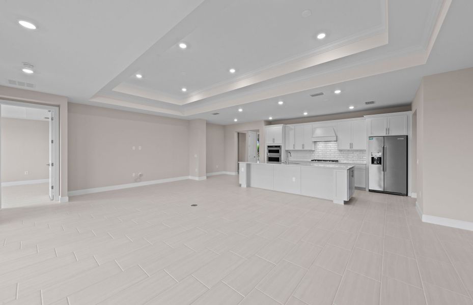 Spacious gathering room featuring a drop tray ceiling Spacious gathering room featuring a drop tray ceiling