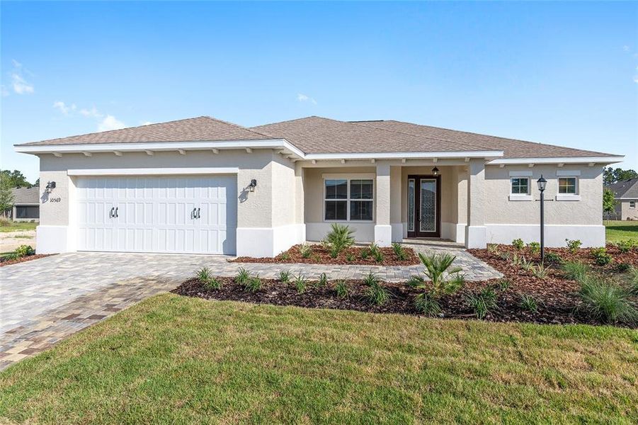 Front exterior of a new home in On Top of the World Communities, Ocala, FL, highlighting curb appeal (Image 16).