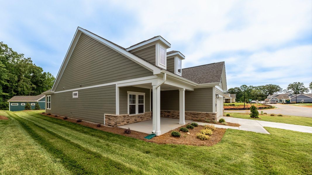 Exterior details and patio area of a home in The Villas at Pinewood, Asheboro (Image 27). Exterior details and patio area of a home in The Villas at Pinewood, Asheboro (Image 27).
