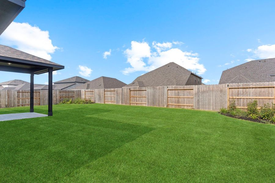 The backyard offers plenty of room for outdoor fun, gardening, or playtime. It’s a great space for entertaining or creating your own outdoor retreat.  Sprinkler system for easy maintenances. Your furry friend's private playground.