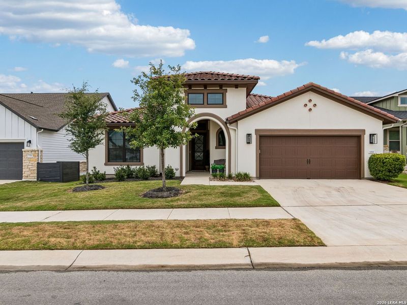 Front exterior of a new home in Kissing Tree, San Marcos, TX, highlighting curb appeal (Image 2). Front exterior of a new home in Kissing Tree, San Marcos, TX, highlighting curb appeal (Image 2).