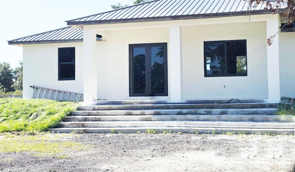 Front exterior of a new home in , Clewiston, FL, highlighting curb appeal (Image 1).