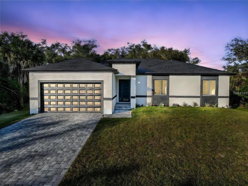 Front exterior of a new home in , Port Charlotte, FL, highlighting curb appeal (Image 1). Front exterior of a new home in , Port Charlotte, FL, highlighting curb appeal (Image 1).
