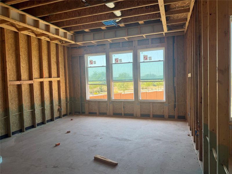 Unfinished framing showcases the structured design and layout of a future living area.
