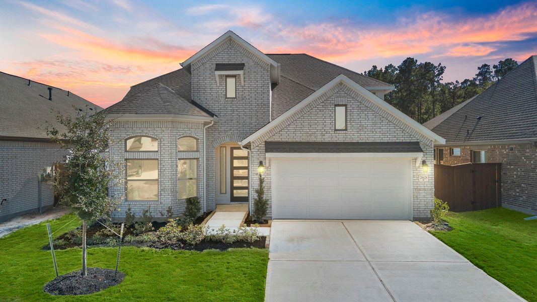 Front exterior of a new home in The Trails, New Caney, TX, highlighting curb appeal (Image 23).