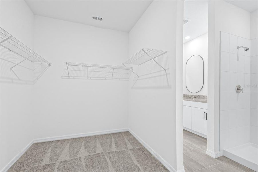 Spacious, unfurnished interior of a new home in The Grove at Stuart Crossing - Premier Series, Bartow (Image 23).