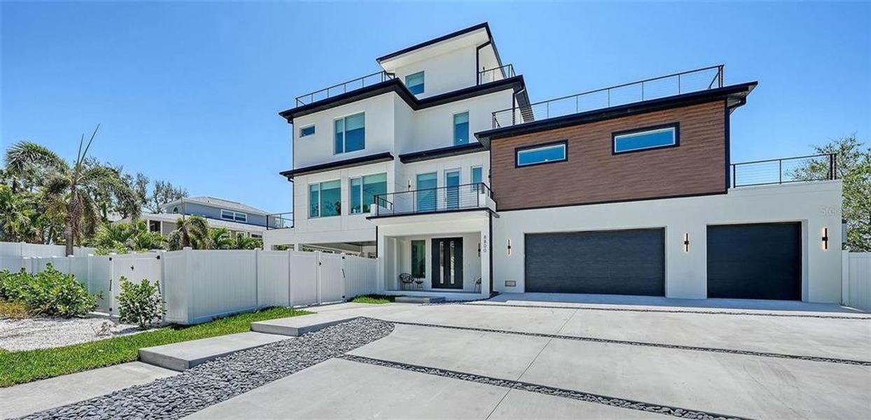 Front exterior of a new home in , Sarasota, FL, highlighting curb appeal (Image 20).