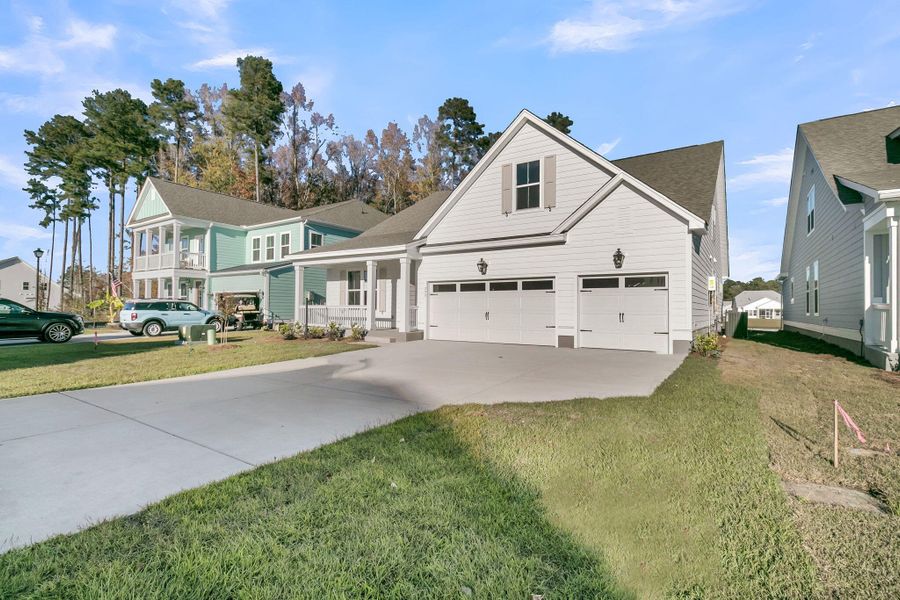 Exterior details and patio area of a home in Tidewater at Lakes of Cane Bay, Summerville (Image 24).