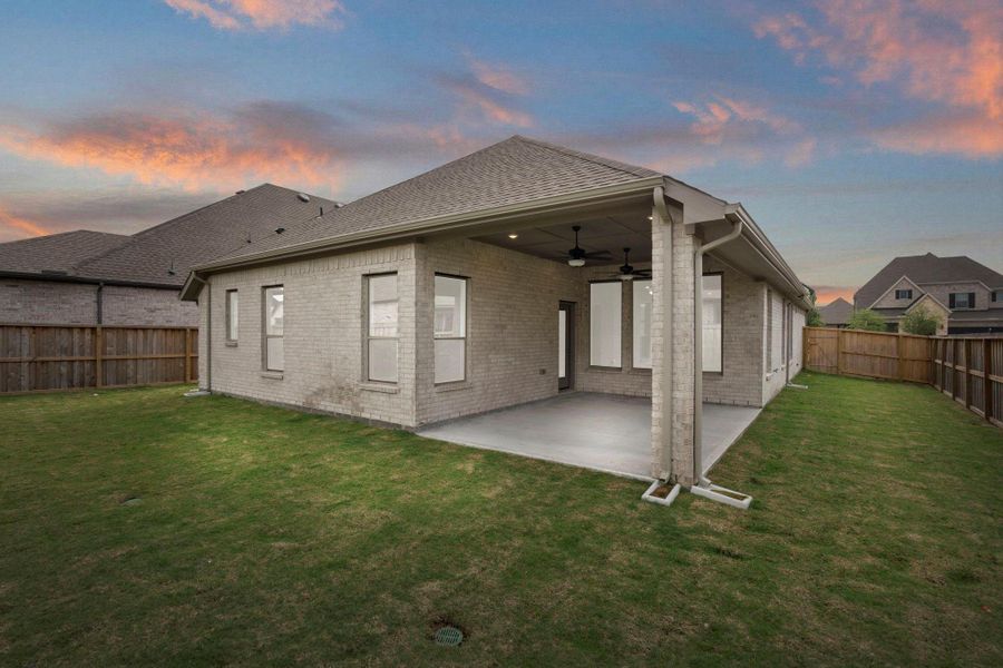 Exterior details and patio area of a home in Dunham Pointe, Cypress (Image 3).