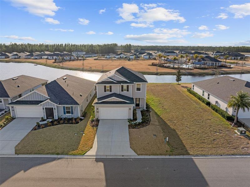 Front exterior of a new home in Somerset - Classic Series, Palm Coast, FL, highlighting curb appeal (Image 26).