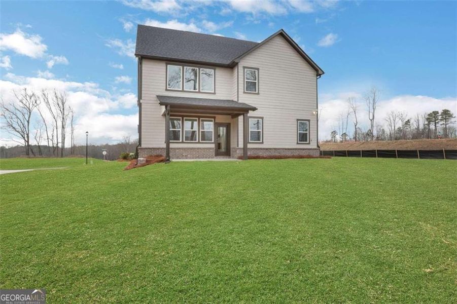 Exterior details and patio area of a home in The Paddocks at Doc Hughes, Buford (Image 27).