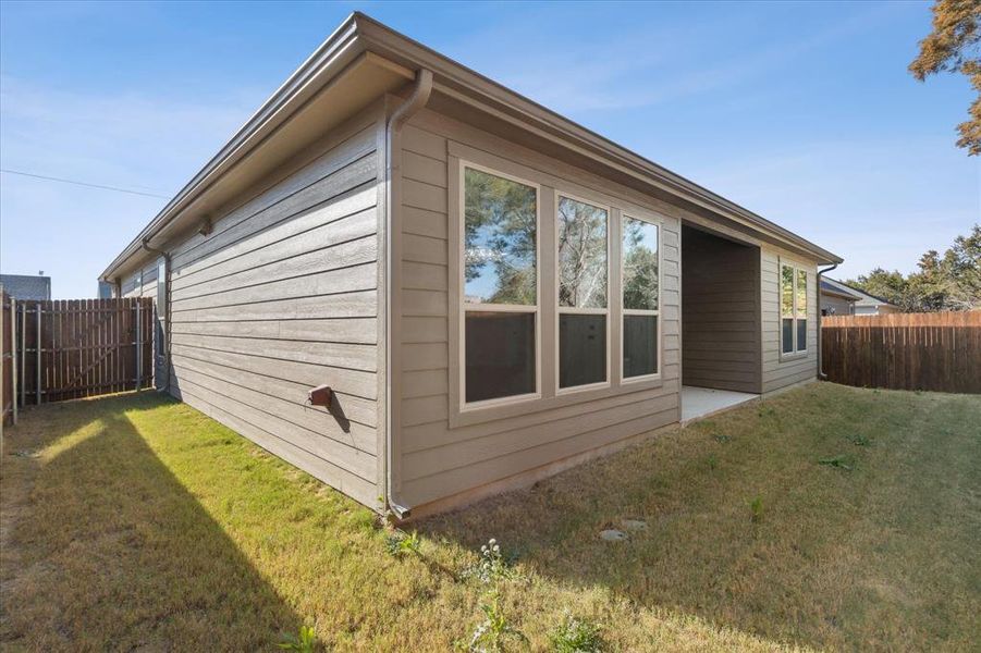 Exterior details and patio area of a home in , Granbury (Image 21).