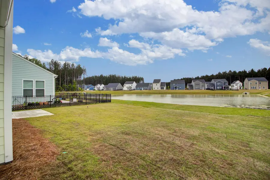 Exterior details and patio area of a home in Homecoming, Ravenel (Image 24).