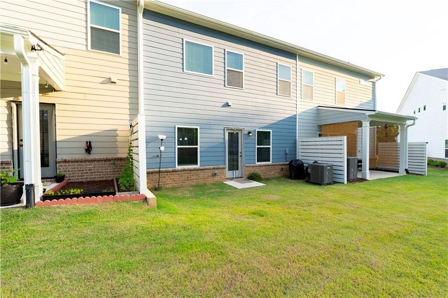Front exterior of a new home in Ellison Square, Sugar Hill, GA, highlighting curb appeal (Image 2).