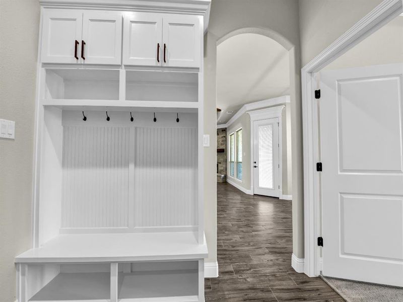 Mudroom with dark hardwood / wood-style flooring