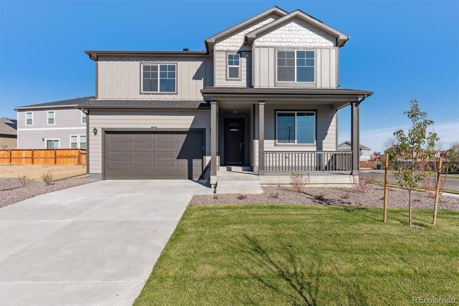 Front exterior of a new home in Trails at Crowfoot, Parker, CO, highlighting curb appeal (Image 20).