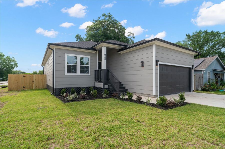 This modern single-story home features a sleek gray exterior with a welcoming front porch and a two-car garage. The well-maintained lawn and simple landscaping enhance its curb appeal. This modern single-story home features a sleek gray exterior with a welcoming front porch and a two-car garage. The well-maintained lawn and simple landscaping enhance its curb appeal.