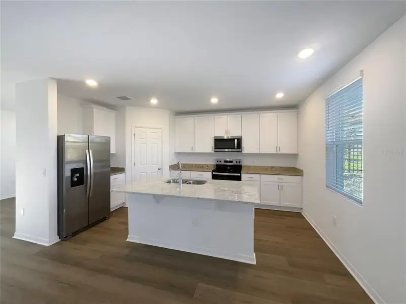 Furnished interior view inside a new home in Eden Hills, Lake Alfred (Image 6).