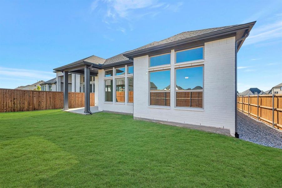 Exterior details and patio area of a home in Sandbrock Ranch, Aubrey (Image 3). Exterior details and patio area of a home in Sandbrock Ranch, Aubrey (Image 3).