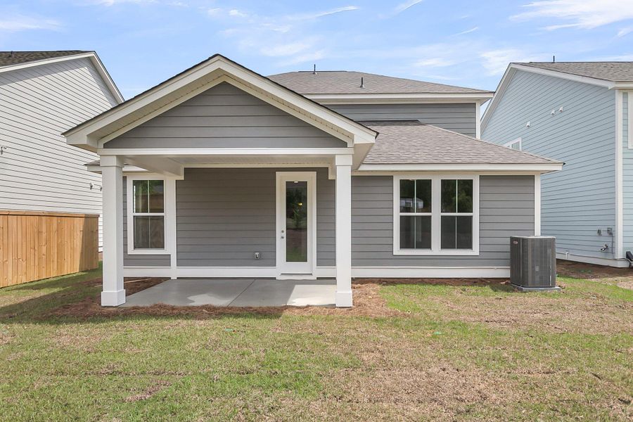 Front exterior of a new home in High Point at Foxbank, Moncks Corner, SC, highlighting curb appeal (Image 27). Front exterior of a new home in High Point at Foxbank, Moncks Corner, SC, highlighting curb appeal (Image 27).