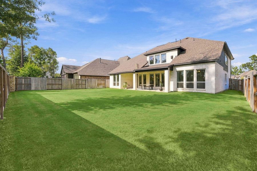 Exterior details and patio area of a home in The Highlands, Porter (Image 27).